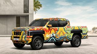 Kia Tasman в красочном камуфляже